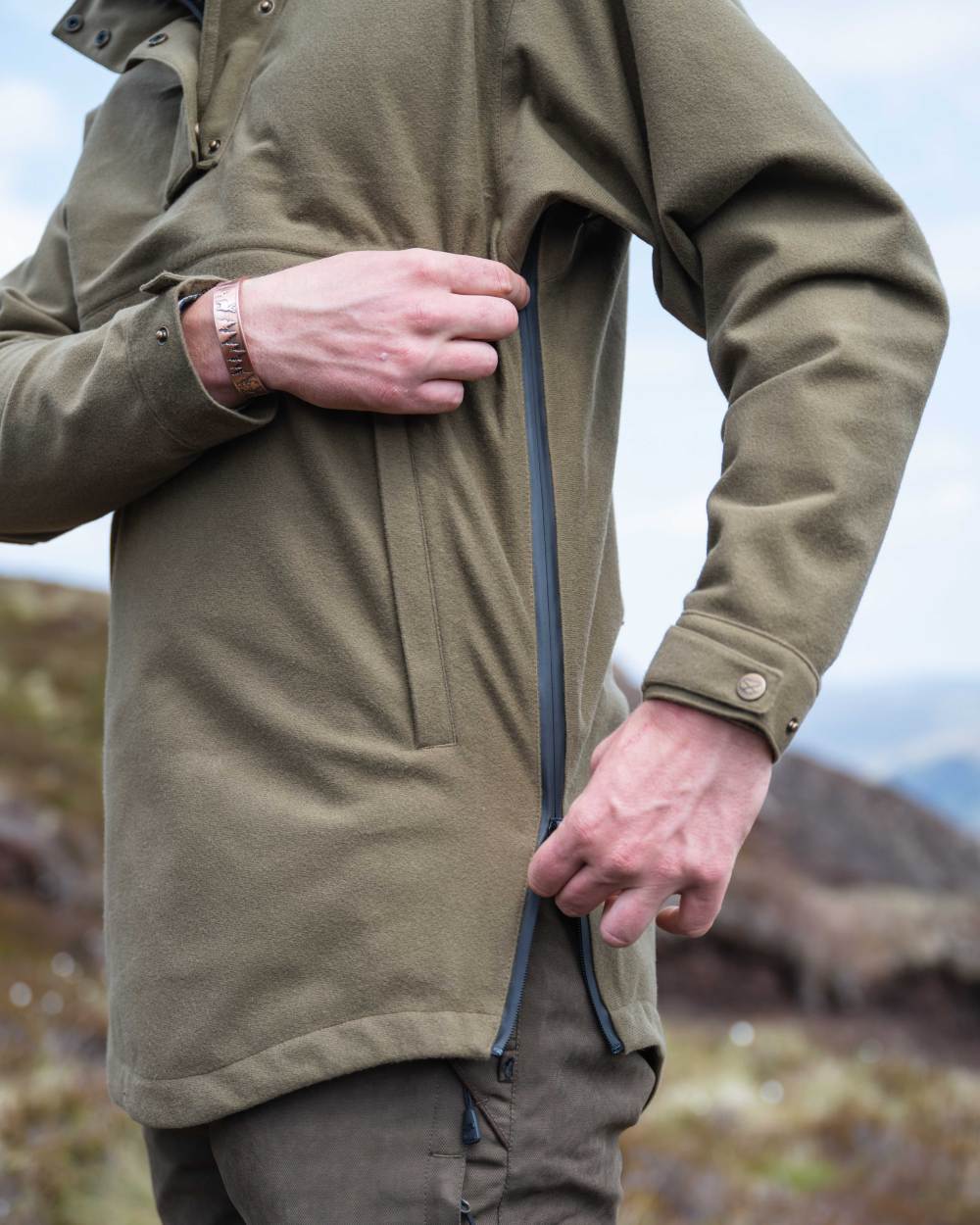 Olive Coloured Hoggs of Fife Mens Torness Trilaminate Waterproof Smock on sky background 