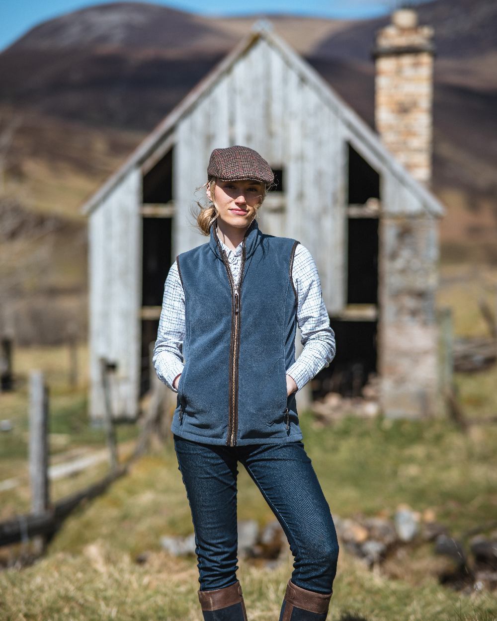 Slate Grey Coloured Hoggs of Fife Stenton Ladies Fleece Gilet on countryside background 