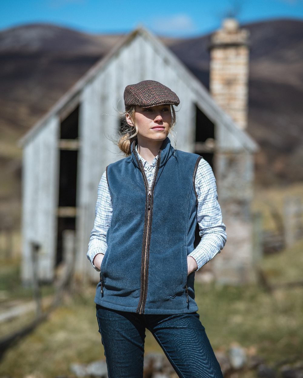 Slate Grey Coloured Hoggs of Fife Stenton Ladies Fleece Gilet on countryside background 