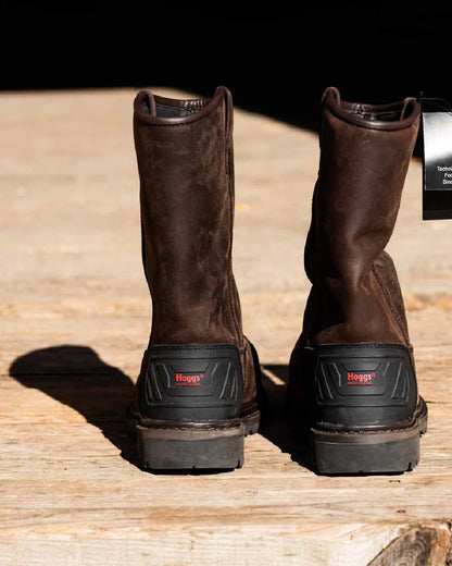 Brown Coloured Hoggs of Fife Thor Safety Rigger Boots on wood background 