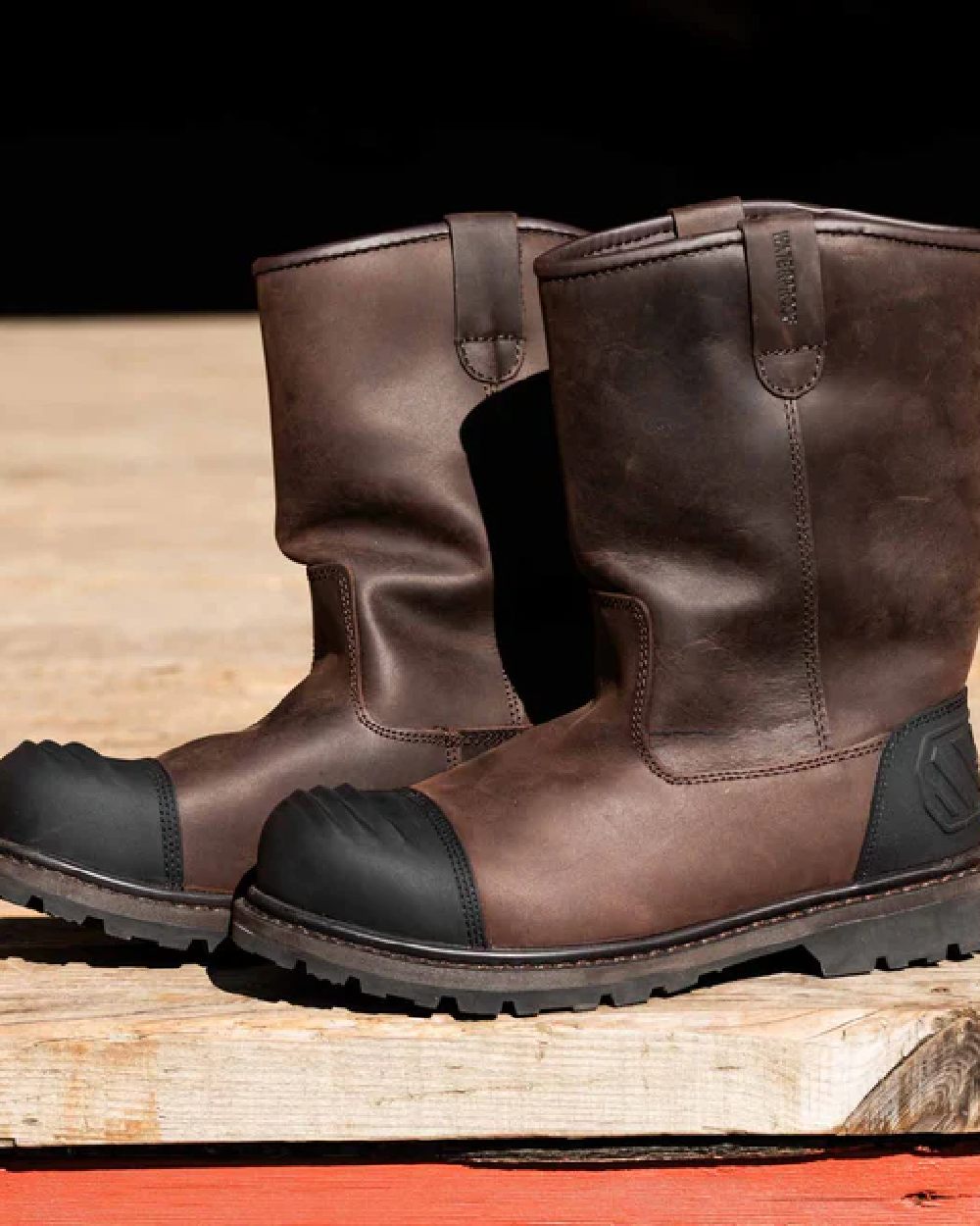 Brown Coloured Hoggs of Fife Thor Safety Rigger Boots on wood background 