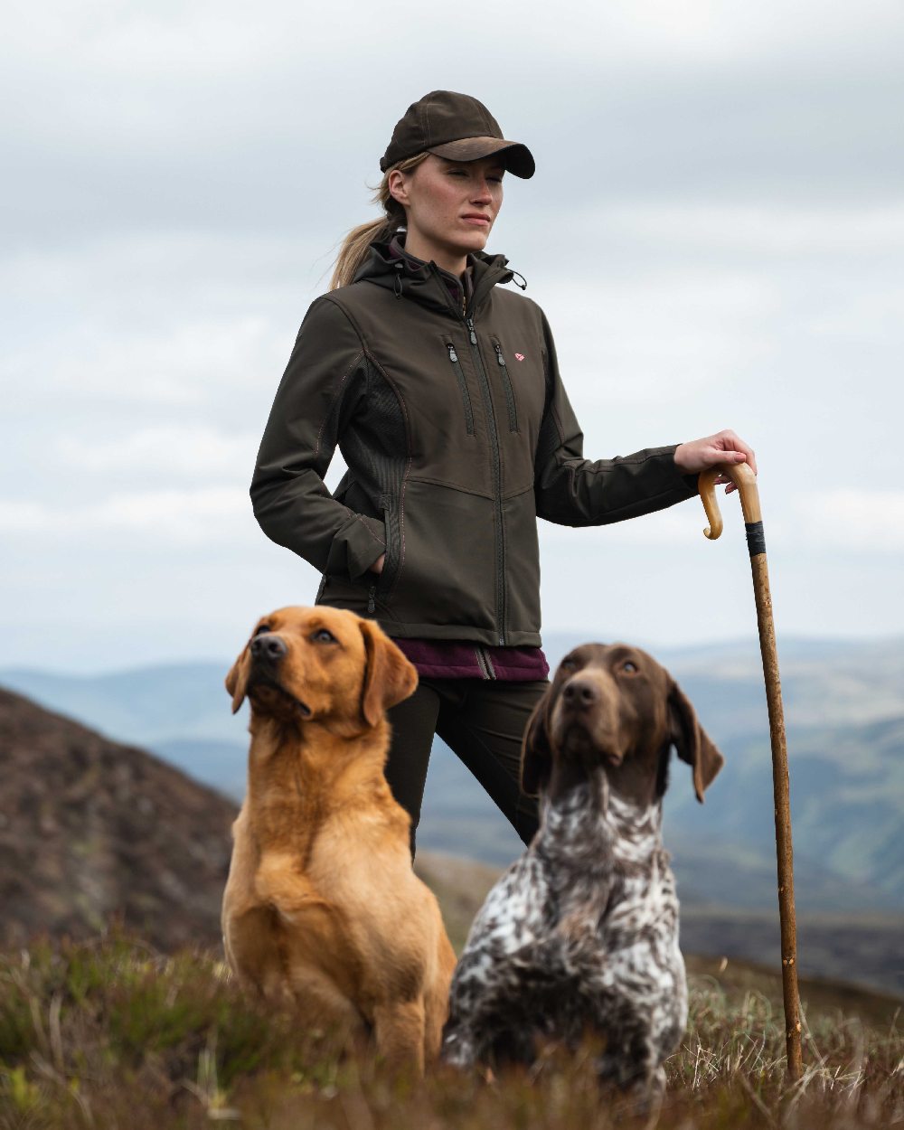 Green Coloured Hoggs of Fife Womens Ardross 4-Way Active Jacket on mountain background 