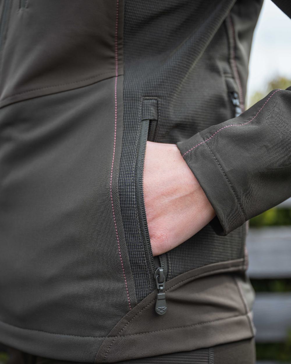 Green Coloured Hoggs of Fife Womens Ardross 4-Way Active Jacket on mountain background 