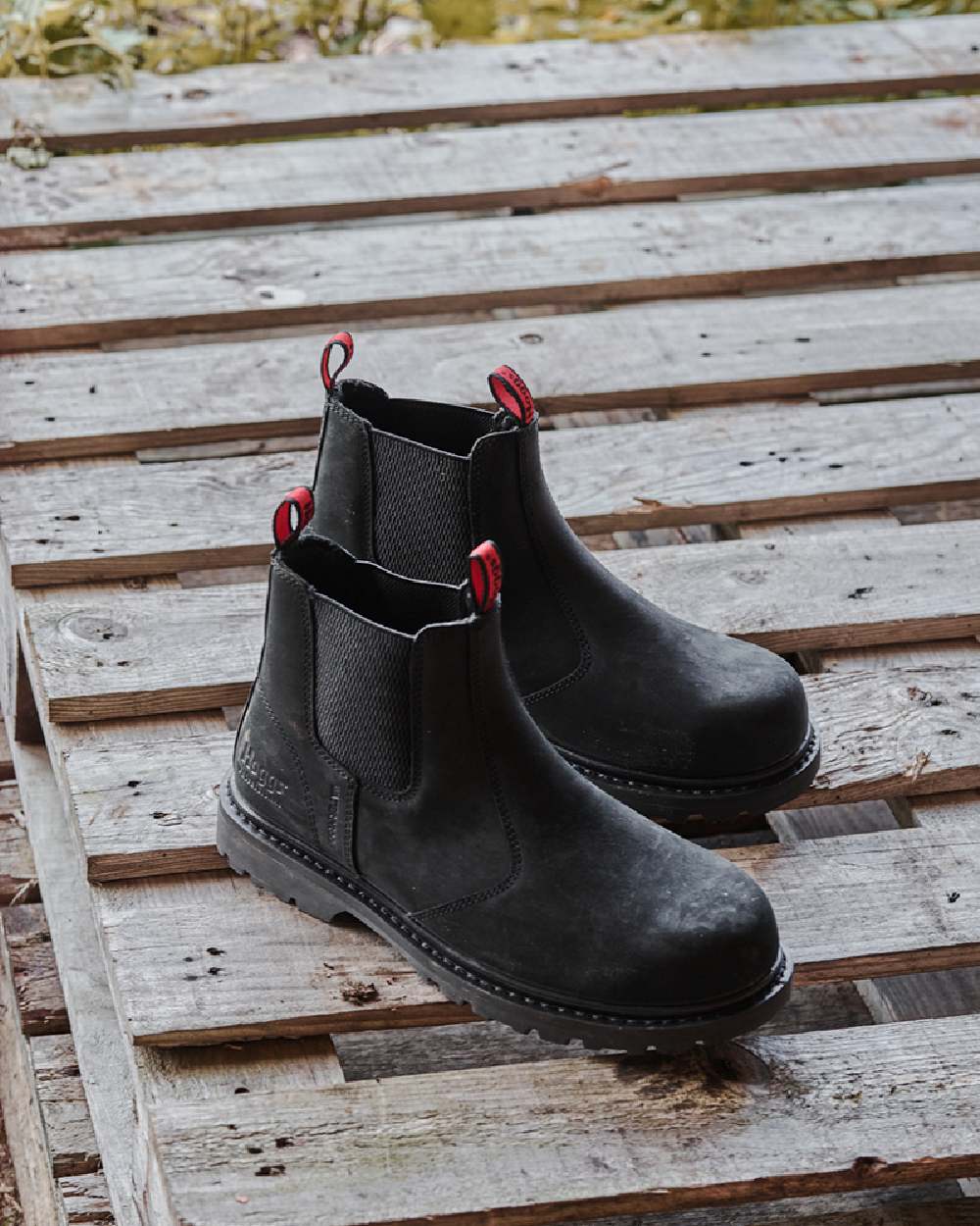 Crazy Horse Black Coloured Hoggs of Fife Zeus Safety Dealer Boots on wood background 