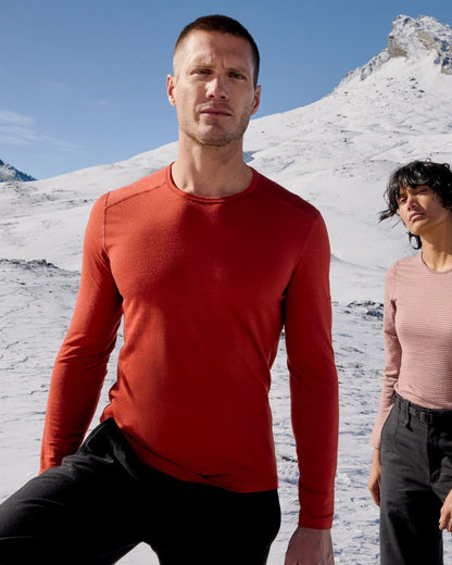 Agate Coloured Icebreaker Mens Merino 200 Oasis Crewe Thermal Top on snow background 