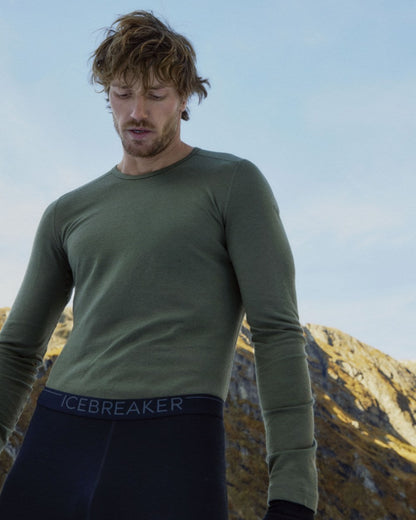 Loden Coloured Icebreaker Mens Merino 200 Oasis Crewe Thermal Top on mountain background 