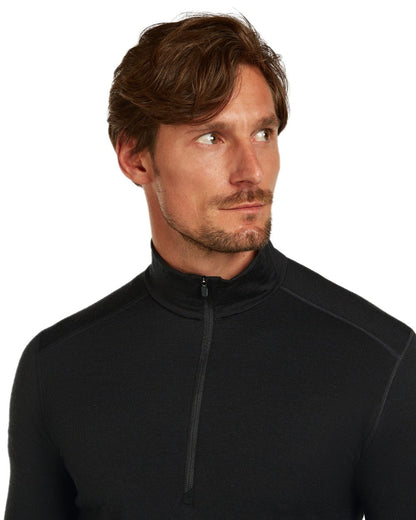 Black Coloured Icebreaker Mens Merino 200 Oasis Half Zip Thermal Top on white background 