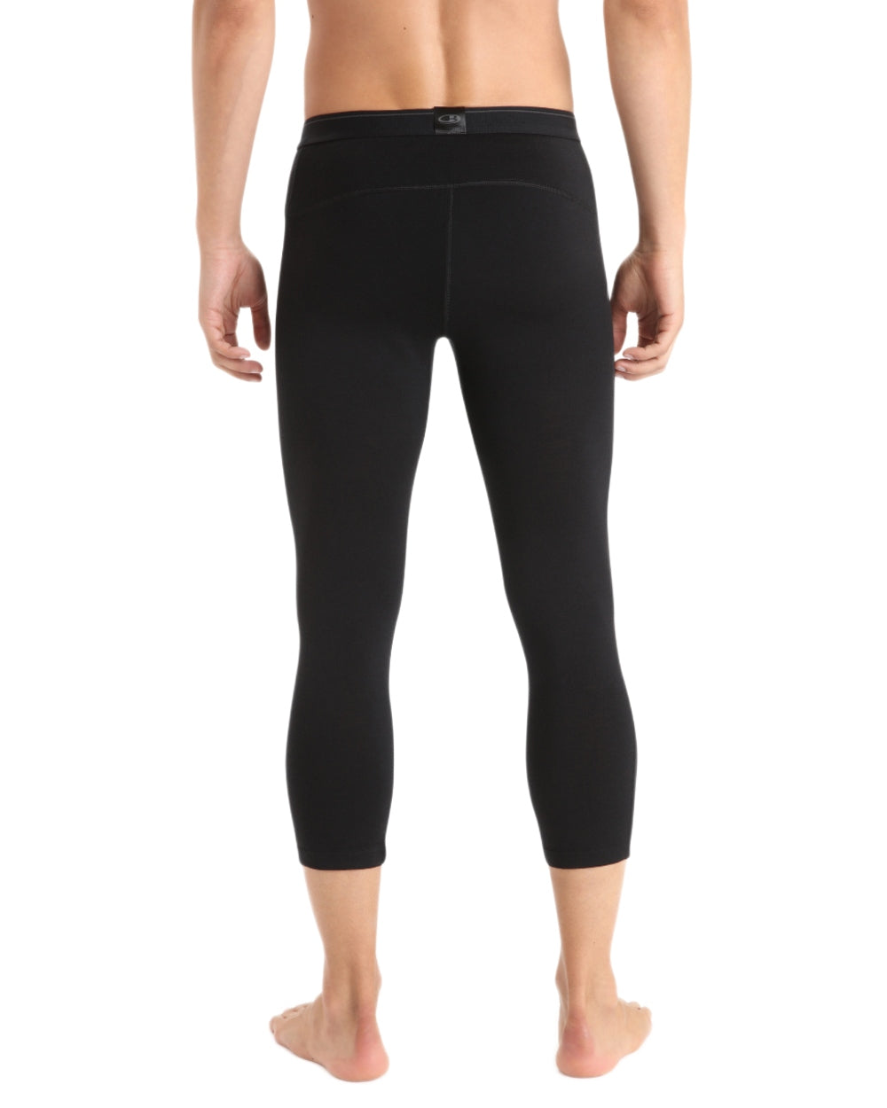 Black coloured Icebreaker Mens Merino 200 Oasis Mid Calf Thermal Leggings on white background 