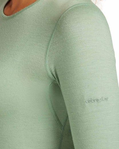Sea Glass Coloured Icebreaker Womens Merino 200 Oasis Crewe Thermal Top on white background 