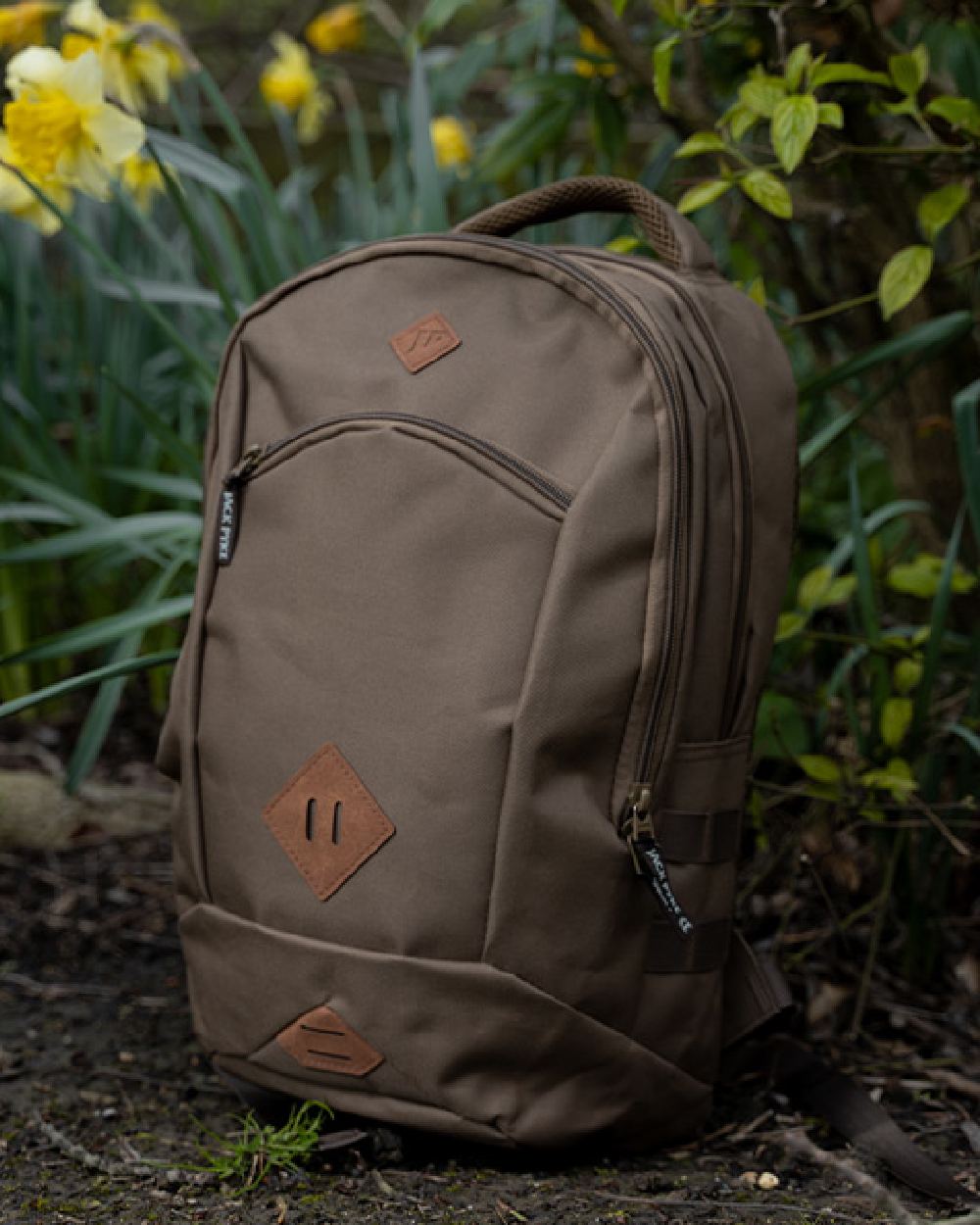 Olive Brown Jack Pyke Kestrel Rucksack on garden background 