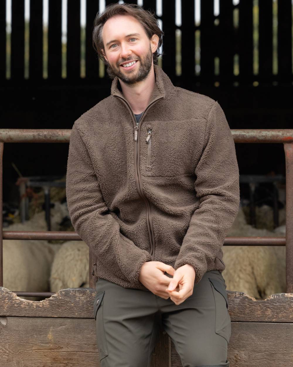 Green coloured Jack Pyke Shires Fleece Jacket on yard background 