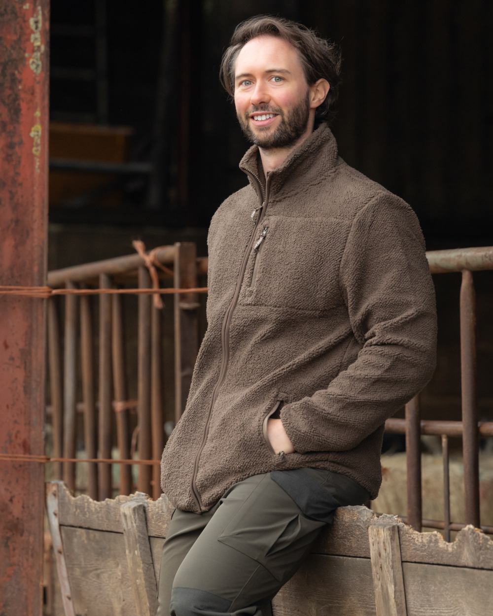 Green coloured Jack Pyke Shires Fleece Jacket on yard background 