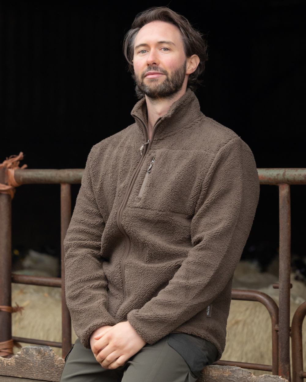 Green coloured Jack Pyke Shires Fleece Jacket on yard background 