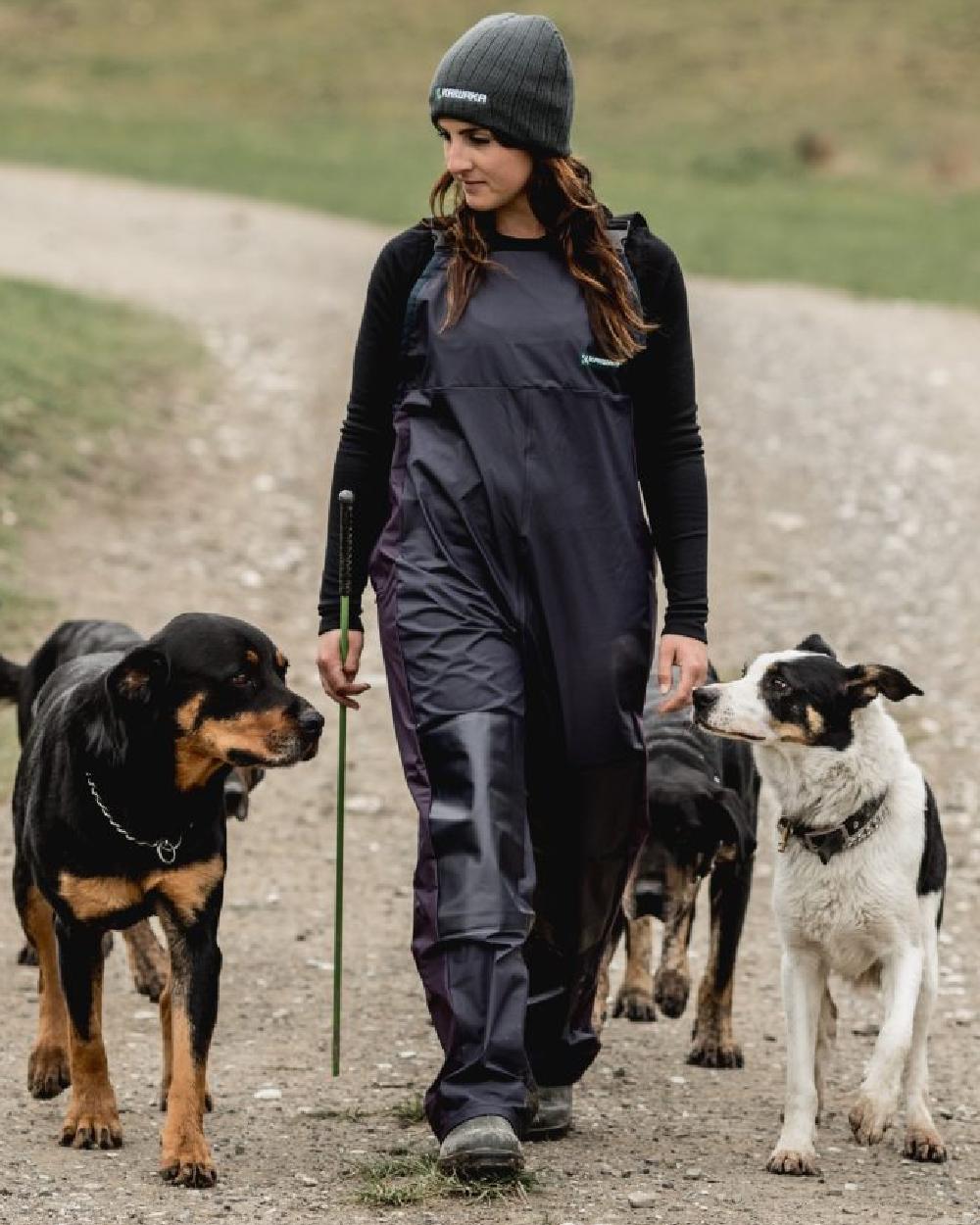 Navy coloured Kaiwaka Womens Lady Of The Land AgTex Bib Overtrousers on grassy background 