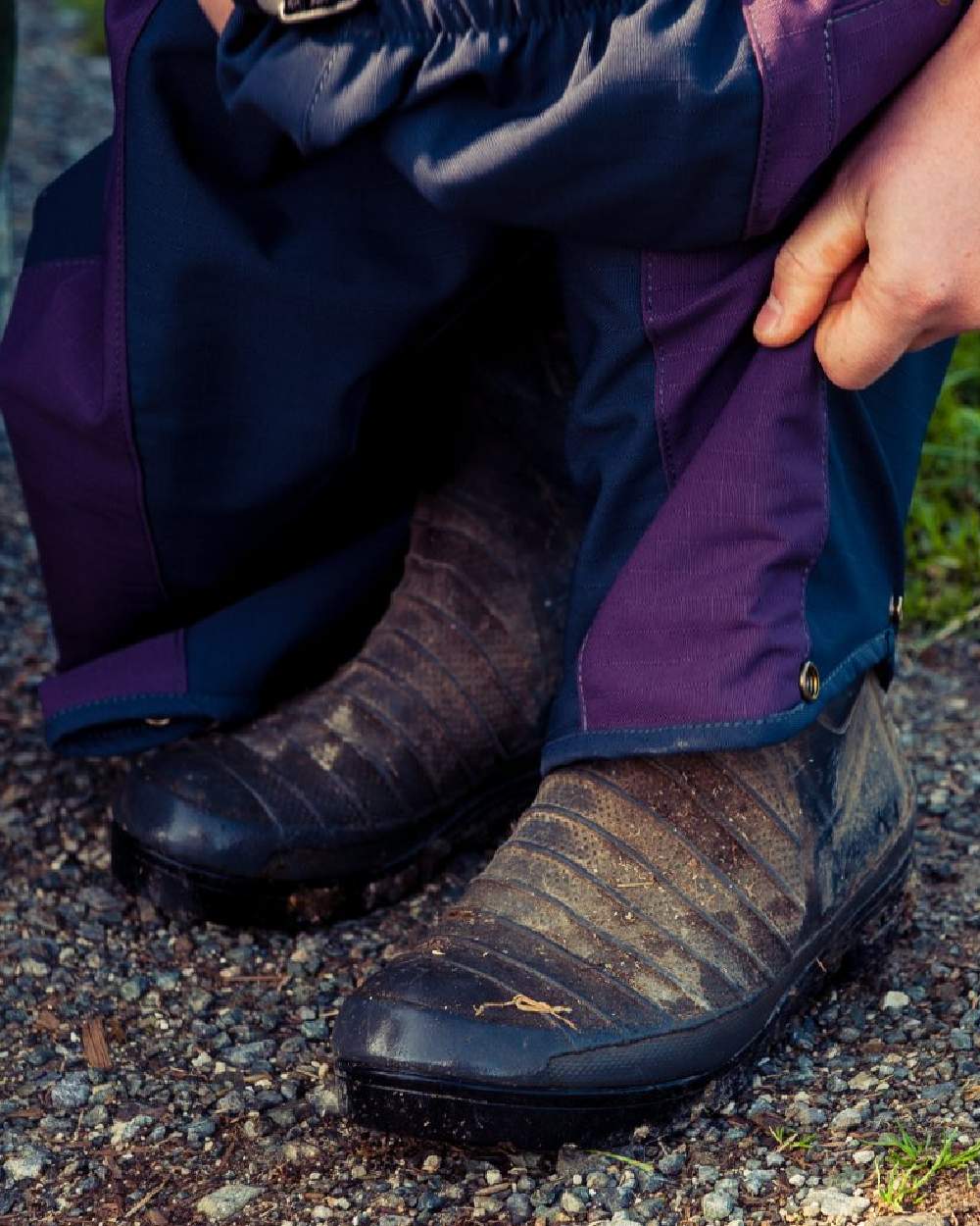 Navy coloured Kaiwaka Womens Stormforce Overtrouser on soil background 