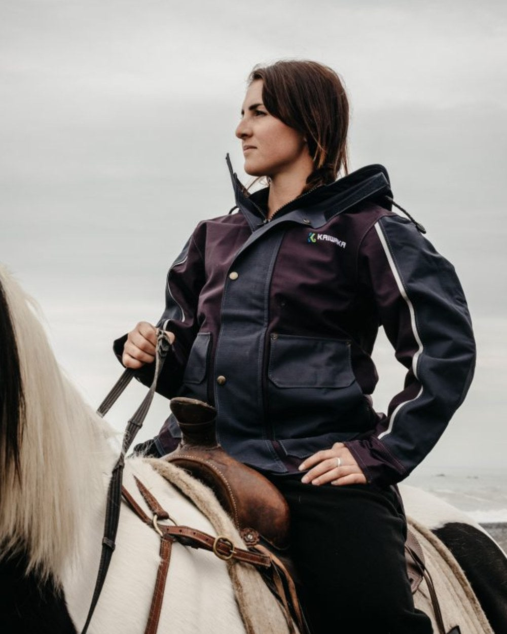 Navy coloured Kaiwaka Womens Stormforce Winter Jacket on sky background 