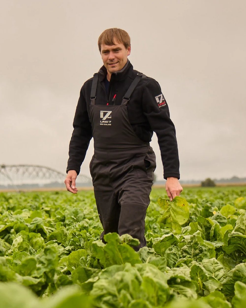Black Coloured Line 7 Mens Territory Storm Pro20 Waterproof Bib Overtrouser on farm background 