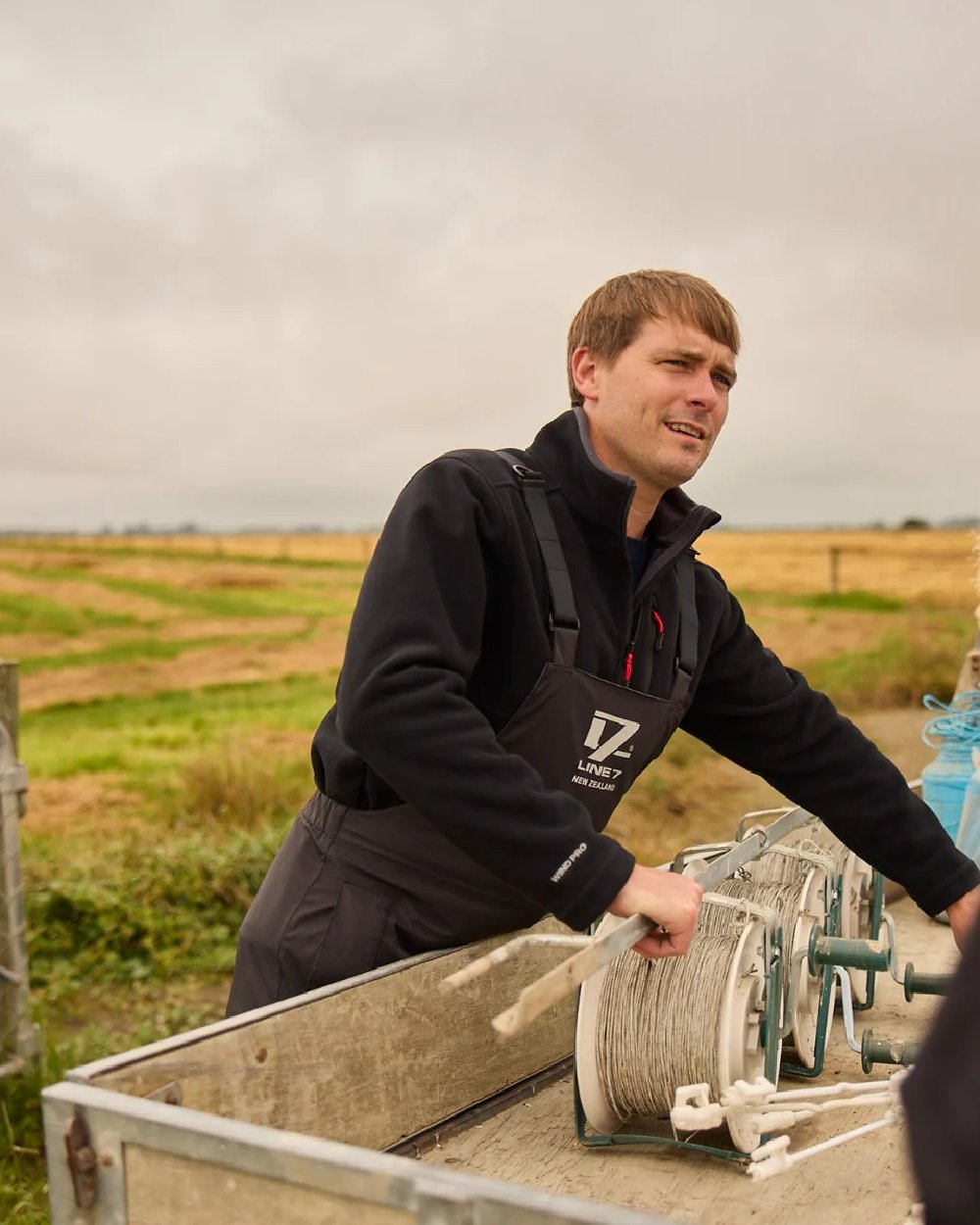 Black Coloured Line 7 Mens Territory Wind Pro Half Zip Fleece Jacket on farm background 
