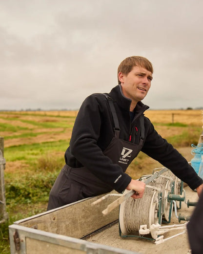 Black Coloured Line 7 Mens Territory Wind Pro Half Zip Fleece Jacket on farm background 
