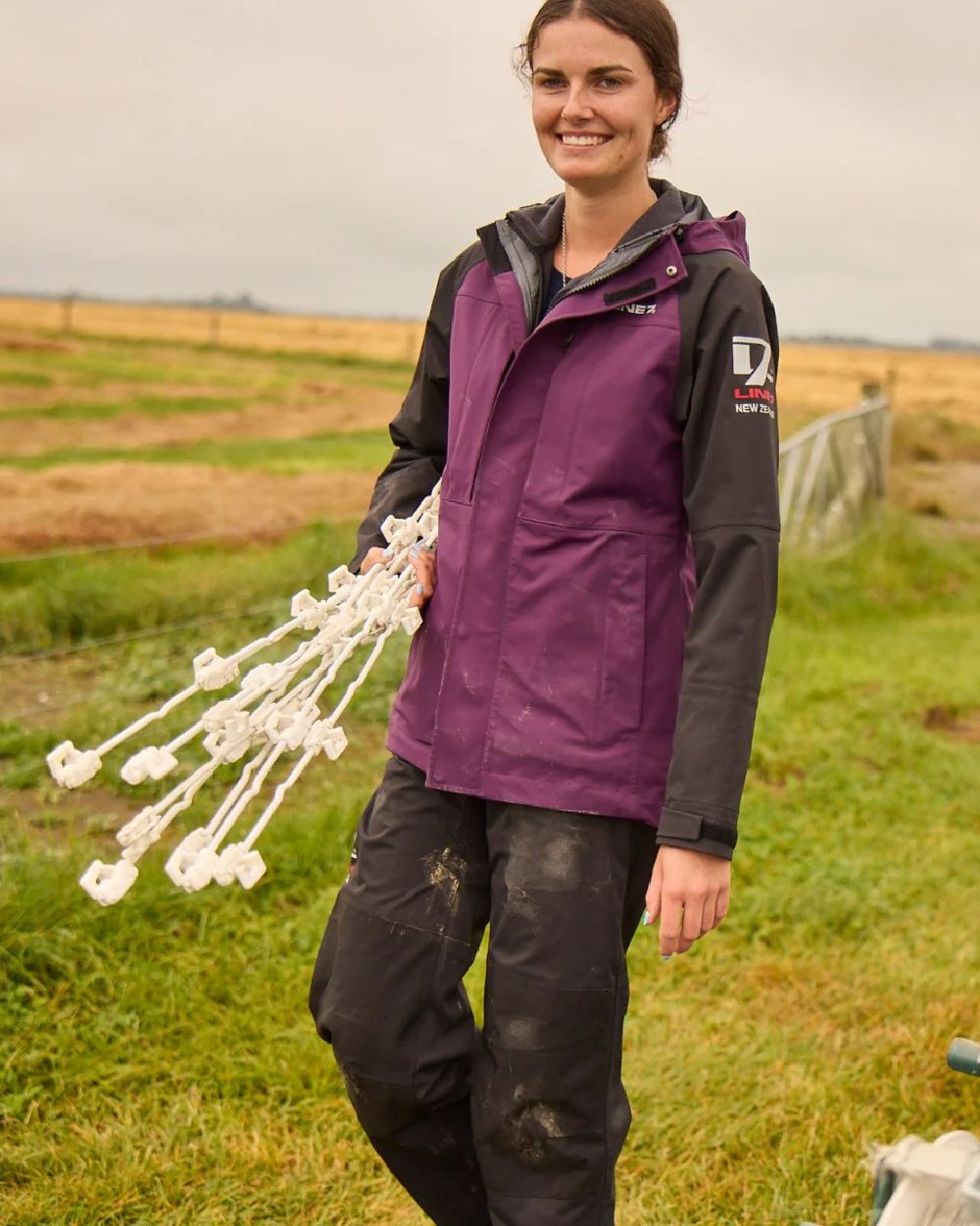 Blackberry Black Colour Line 7 Womens Territory Storm Pro20 Waterproof Jacket on farm background 