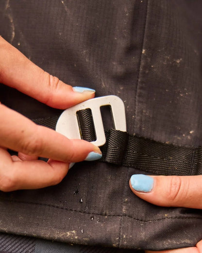 Black coloured Line 7 Womens Territory Storm Pro20 Waterproof Overtrouser on farm background 