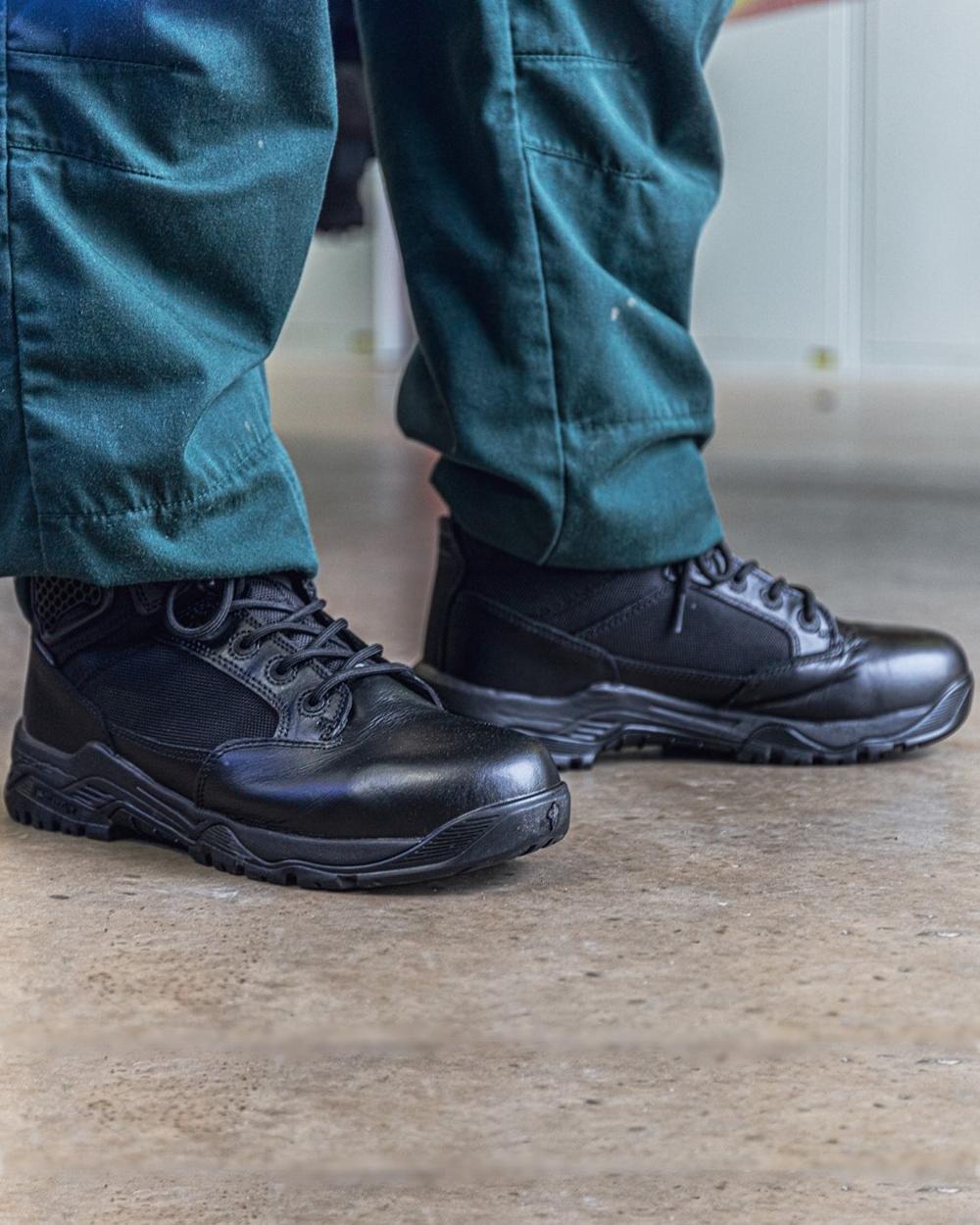 Black Coloured Magnum Mens Strike Force 6.0 Waterproof Uniform Boots on outdoor background 