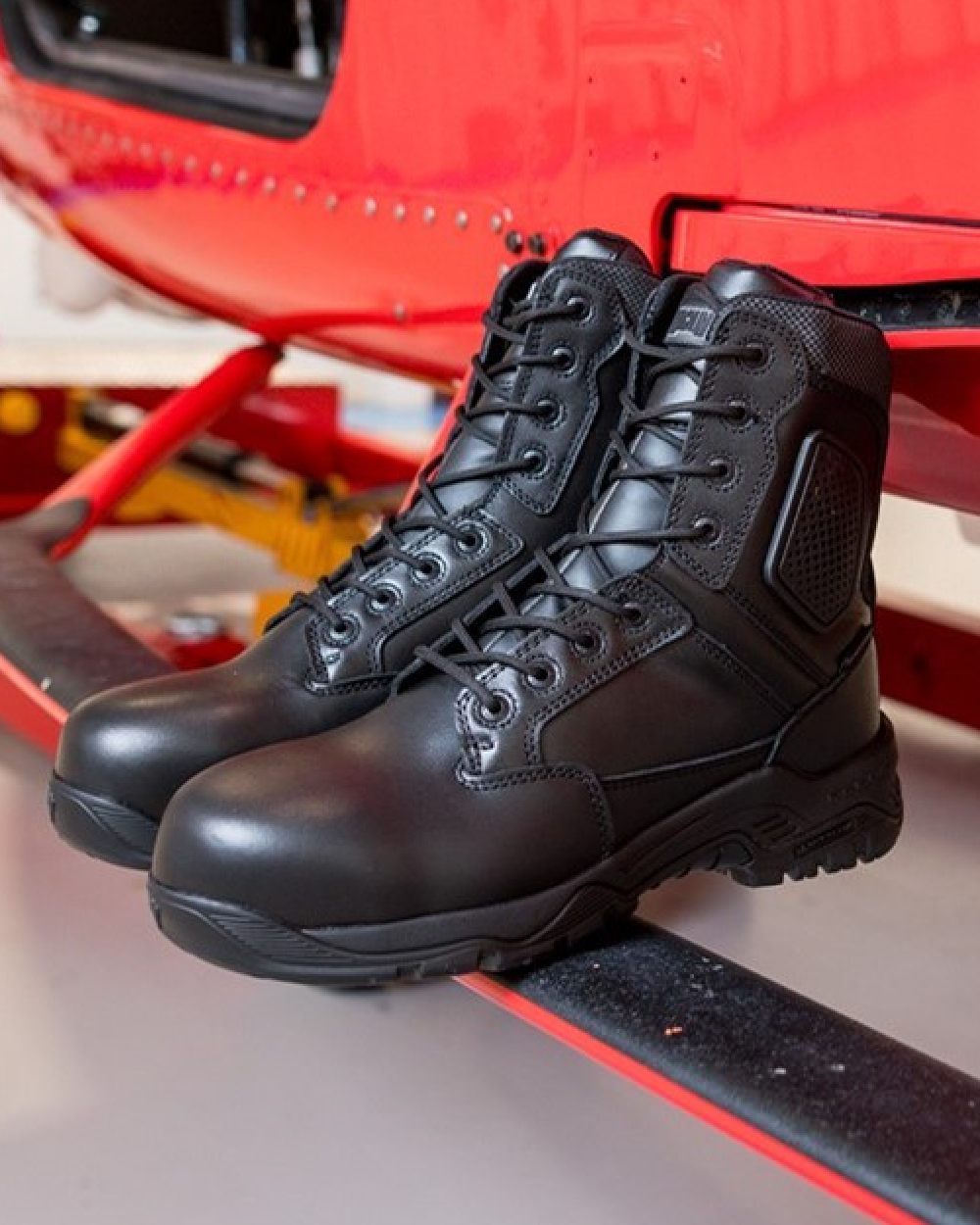 Black Coloured Magnum Strike Force 8.0 Side-Zip CT CP Waterproof Uniform Safety Boots on outdoor background 