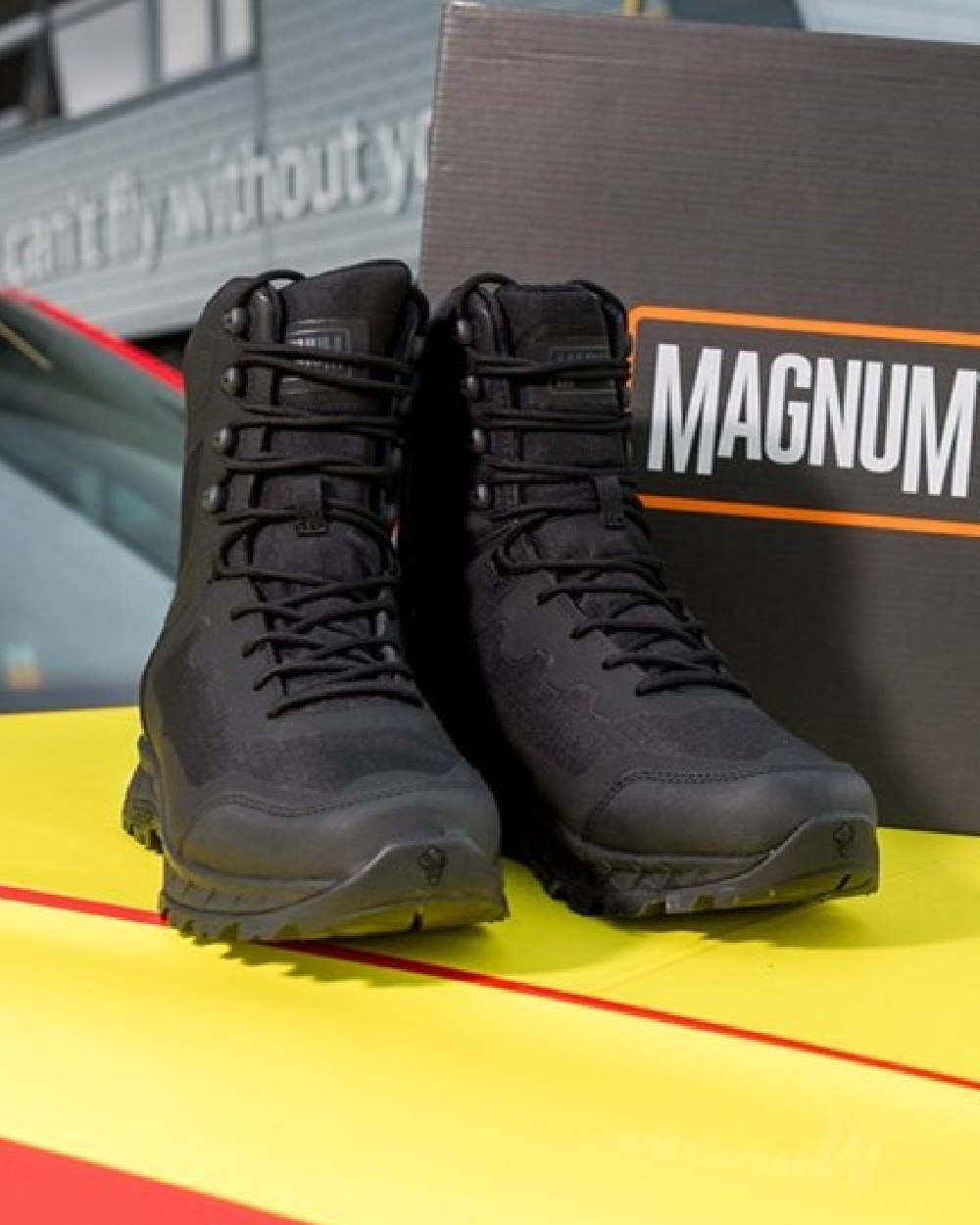 Black Coloured Magnum Ultima Pro 8.0 Waterproof Side-Zip Uniform Boots on outdoor background 