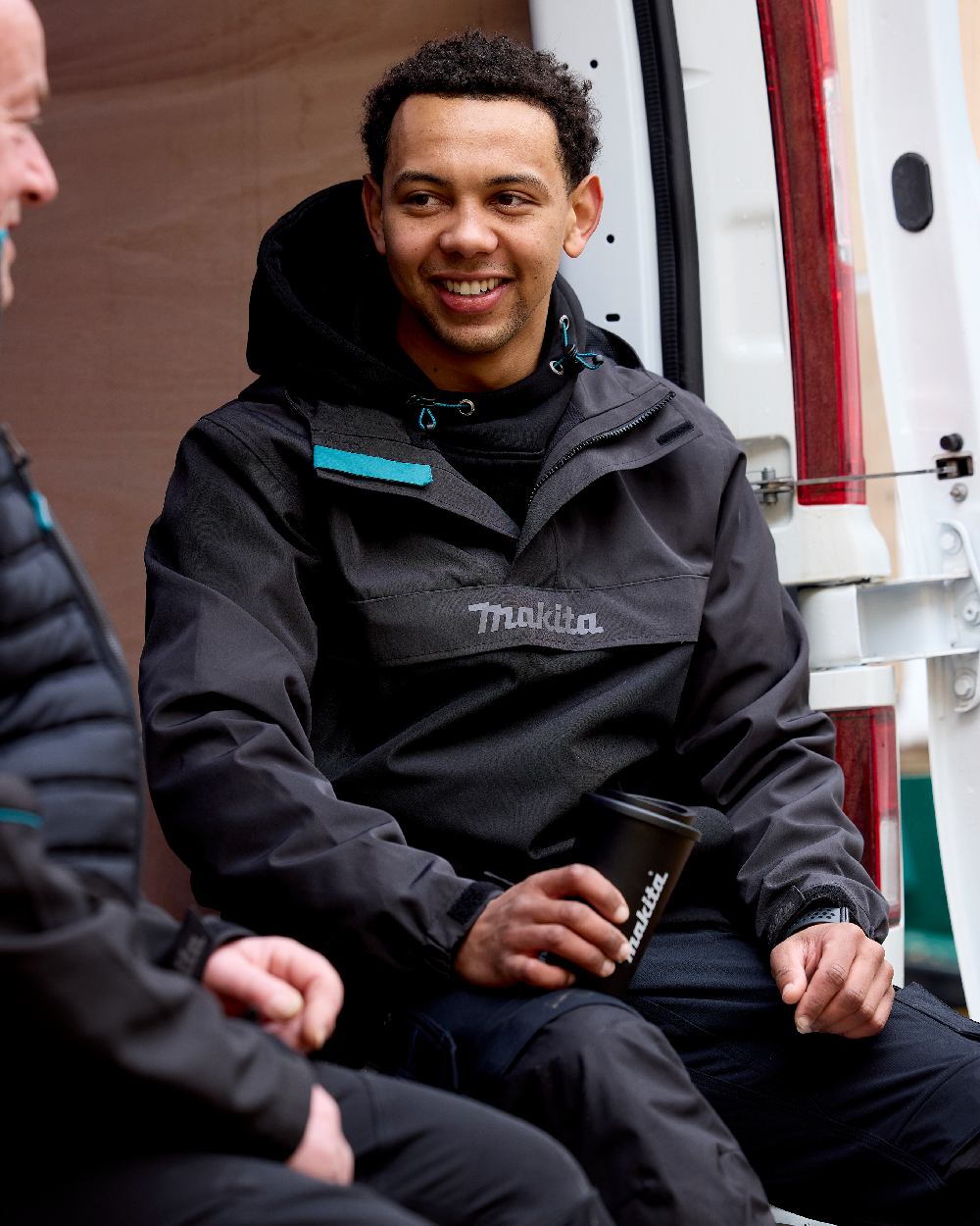 Grey Coloured Makita Mens Aero Jacket on outdoor background 