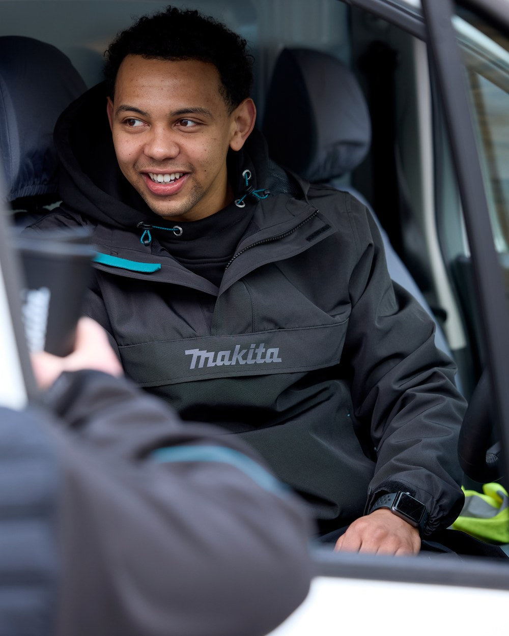 Grey Coloured Makita Mens Aero Jacket on car background 