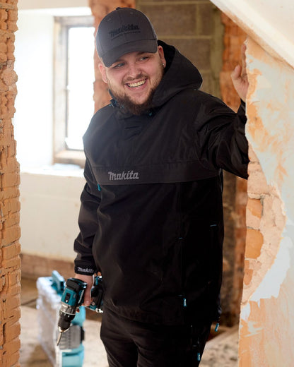 Grey Coloured Makita Mens Aero Jacket on indoor background 