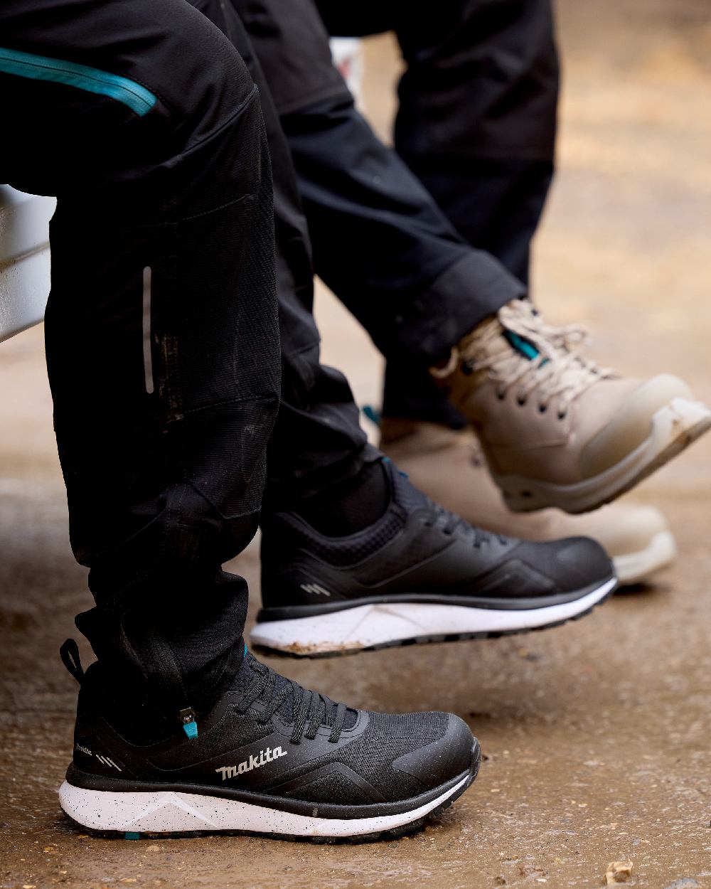 Black Coloured Makita Mens Kobe Safety Trainers on outdoor background 