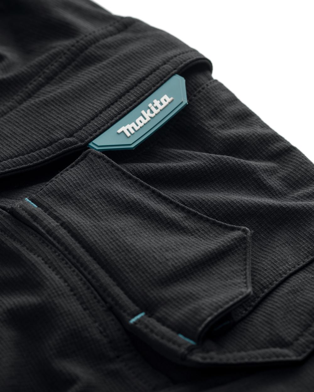 Black Coloured Makita Mens Onyx Stretch Trousers on white background 
