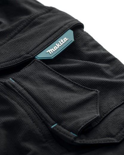 Black Coloured Makita Mens Onyx Stretch Trousers on white background 