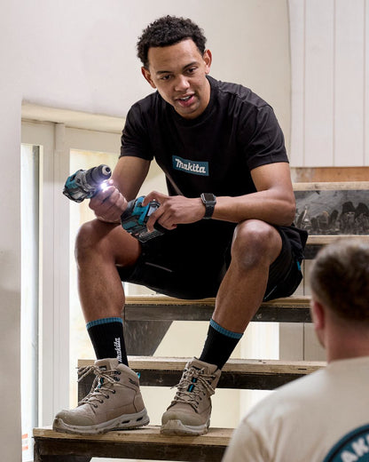Black Coloured Makita Mens Origin T-Shirt on construction background 