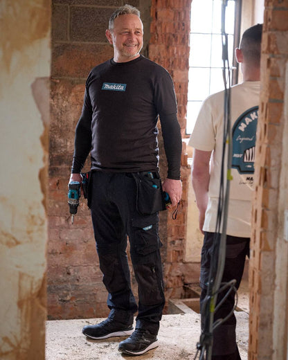 Black Coloured Makita Mens Origin T-Shirt on construction background 