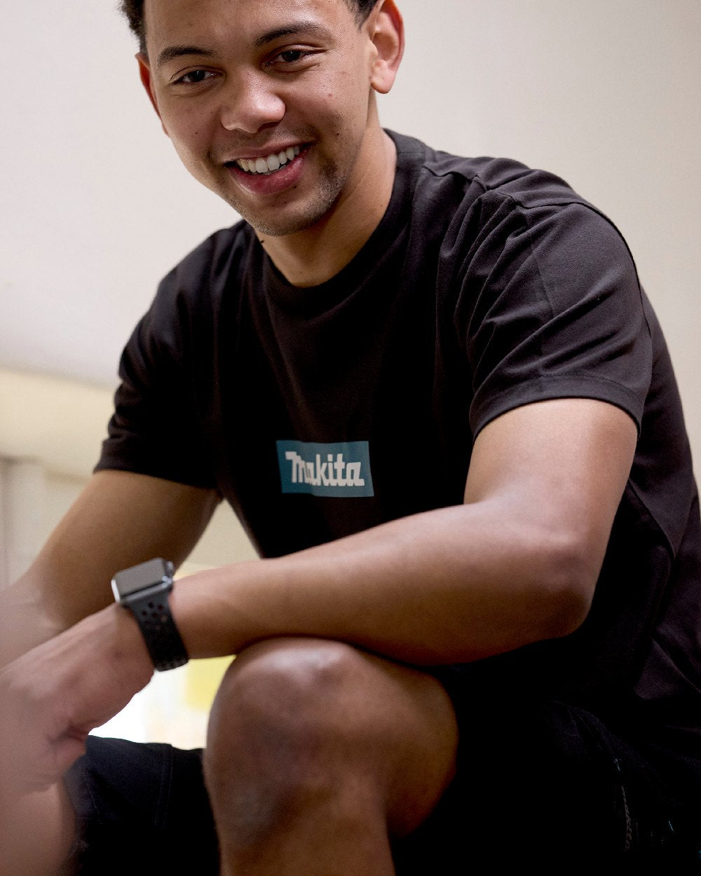 Black Coloured Makita Mens Origin T-Shirt on construction background 