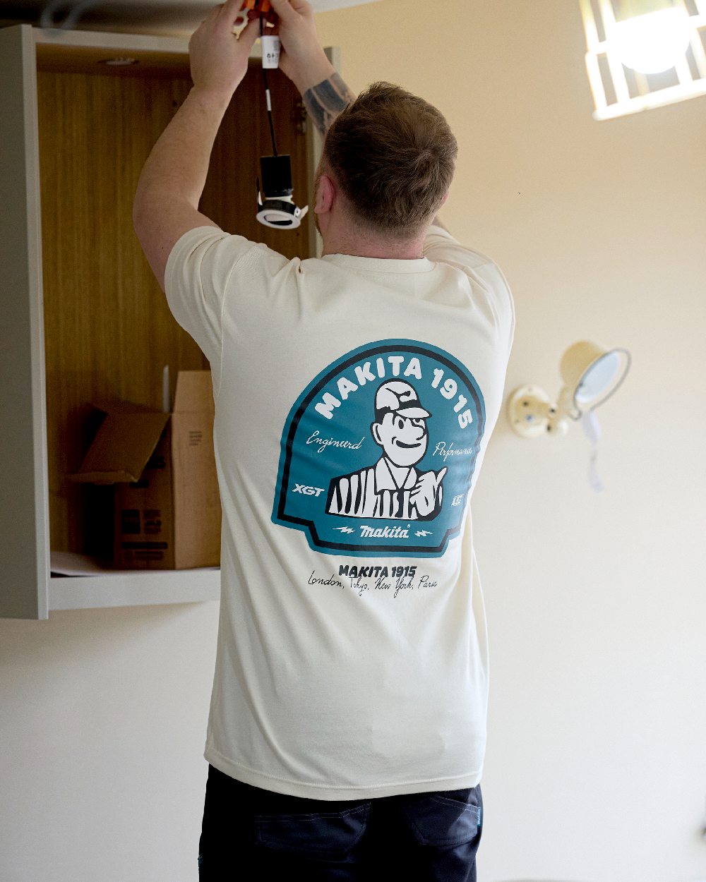 White Coloured Makita Mens Origin T-Shirt on indoor background 