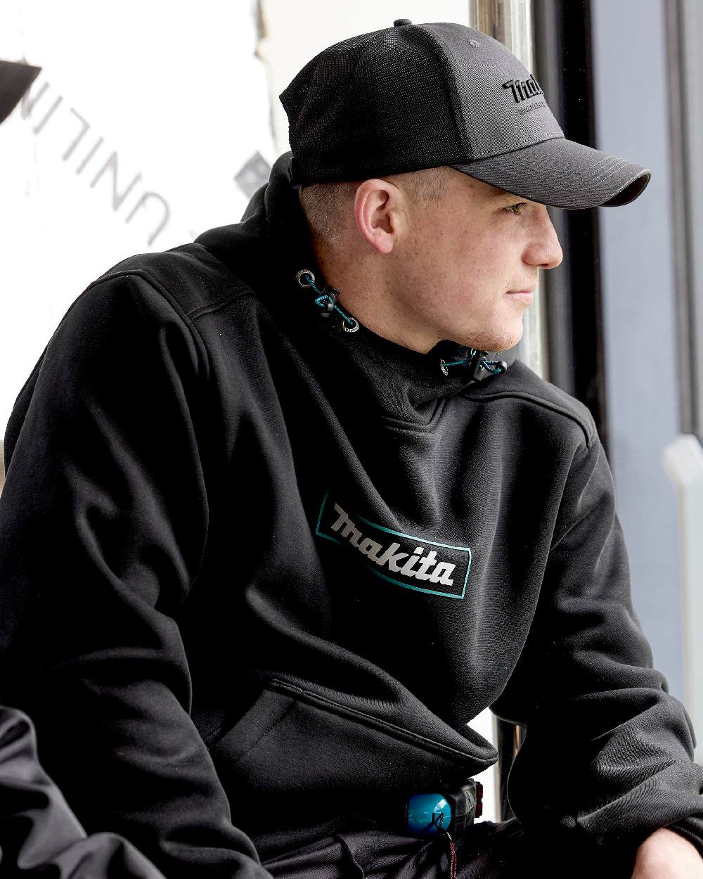 Grey Coloured Makita Mens Origin Trucker Cap on outdoor background 