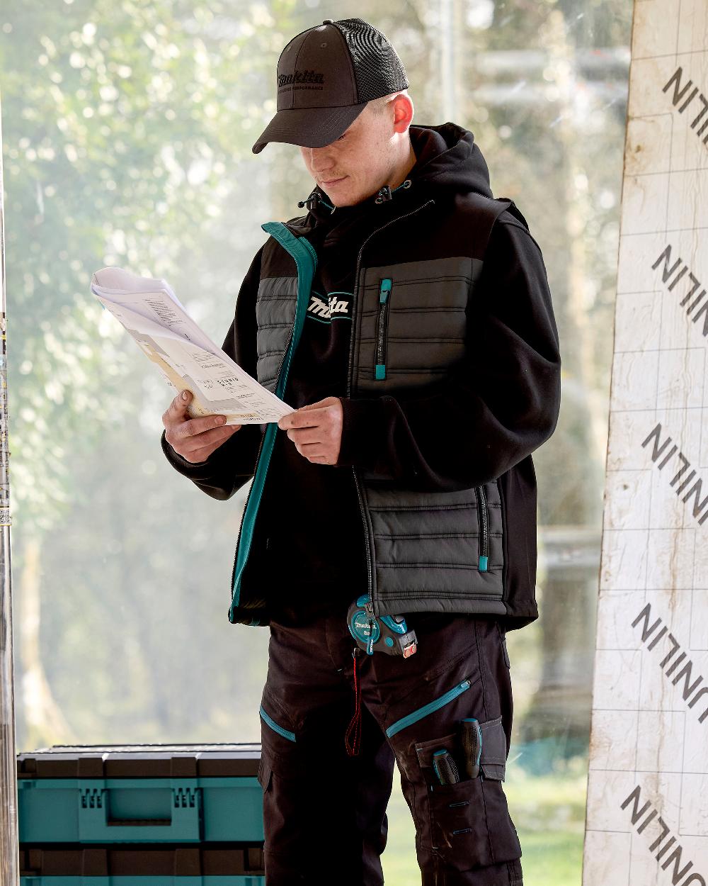 Grey Coloured Makita Mens Shield Bodywarmer on outdoor background 