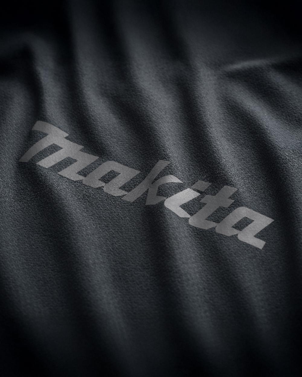 Black Coloured Makita Mens Tech Baselayer Top on white background 