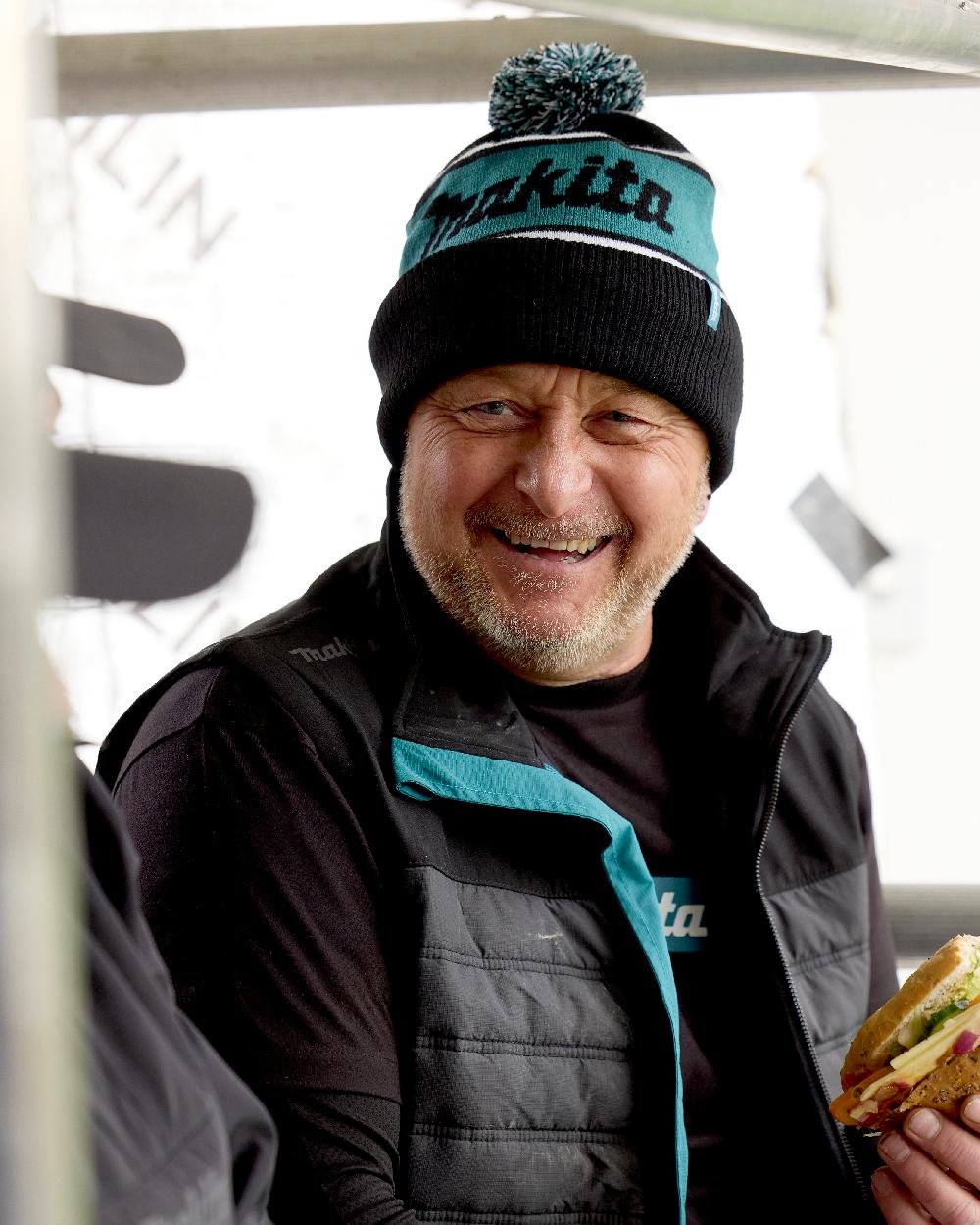 Black Coloured Makita Origin Bobble Hat on outdoor background 