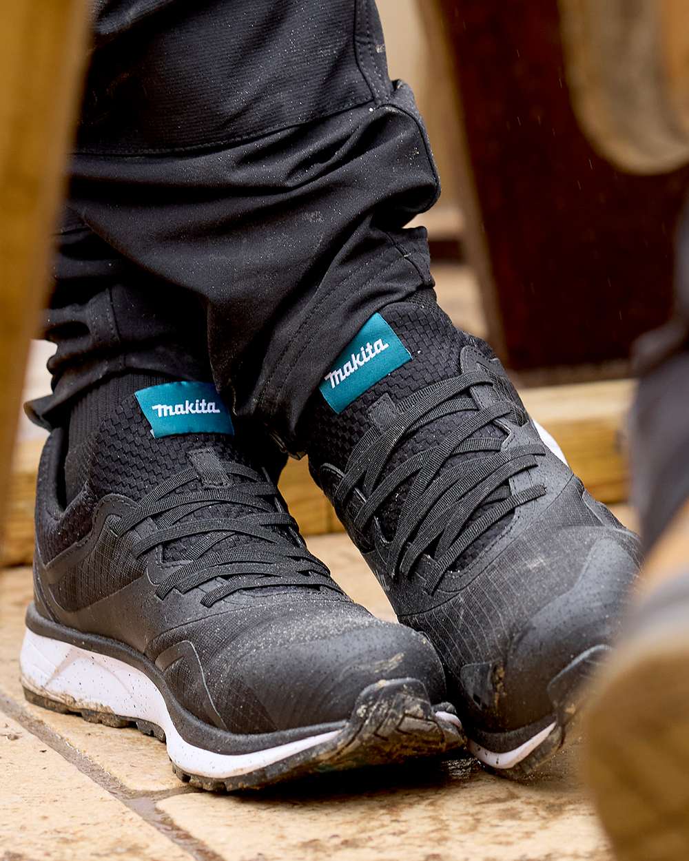 Black Coloured Makita Womens Kobe Safety Trainers on outdoor background 