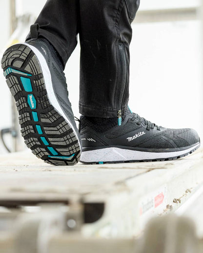 Black Coloured Makita Womens Kobe Safety Trainers on outdoor background 