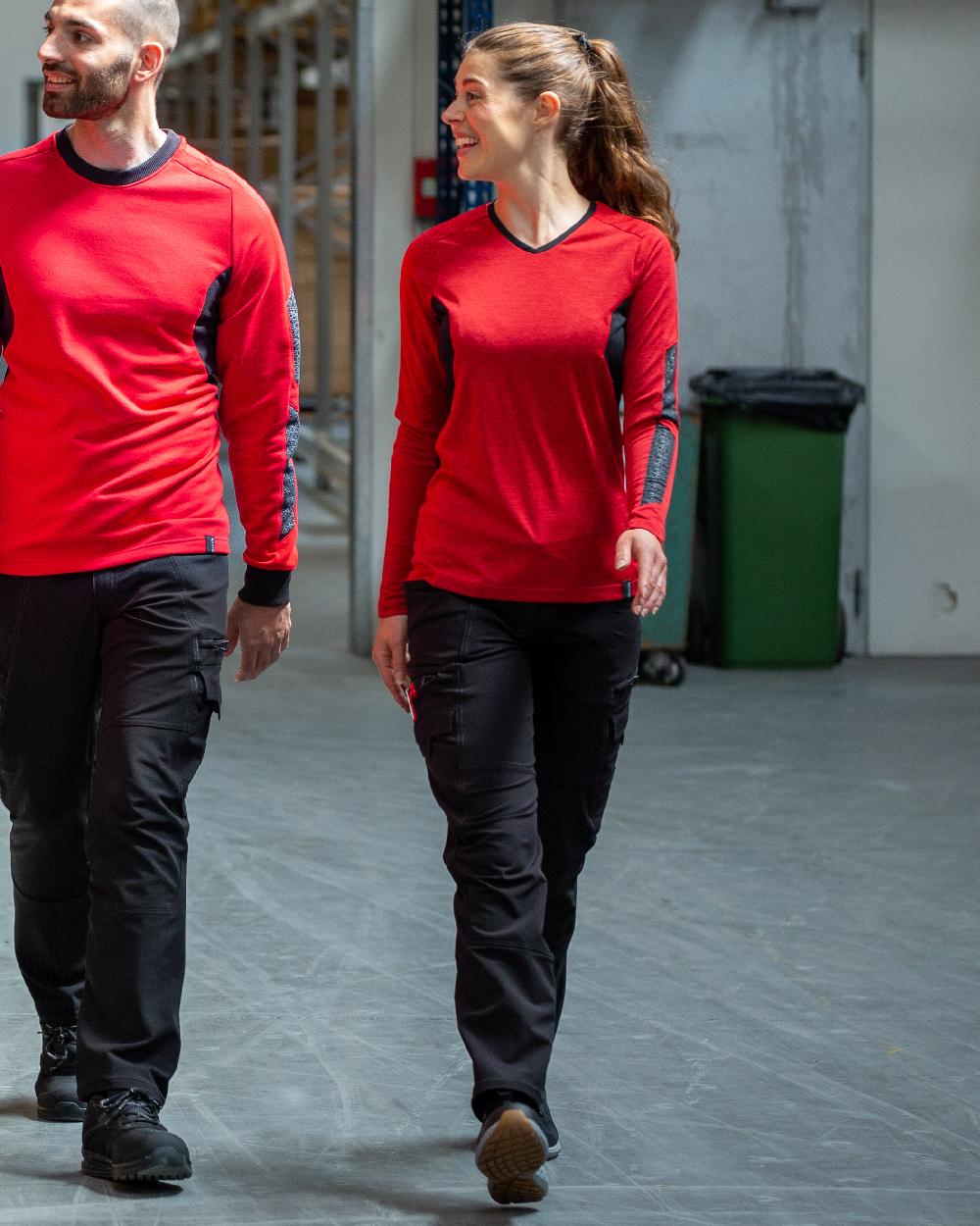 Traffic Red Black Coloured Mascot Womens Accelerate V-Neck Long Sleeved T-Shirt on factory background 