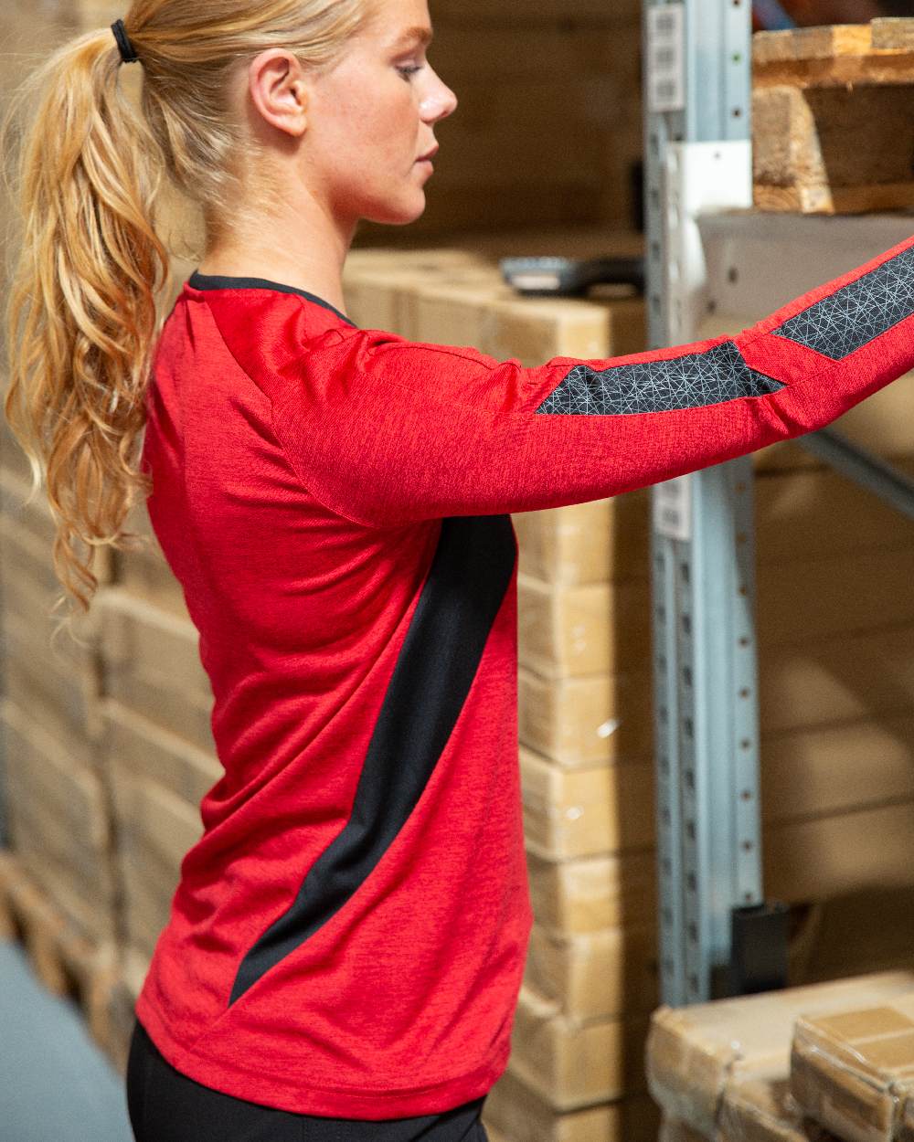 Traffic Red Black Coloured Mascot Womens Accelerate V-Neck Long Sleeved T-Shirt on factory background 