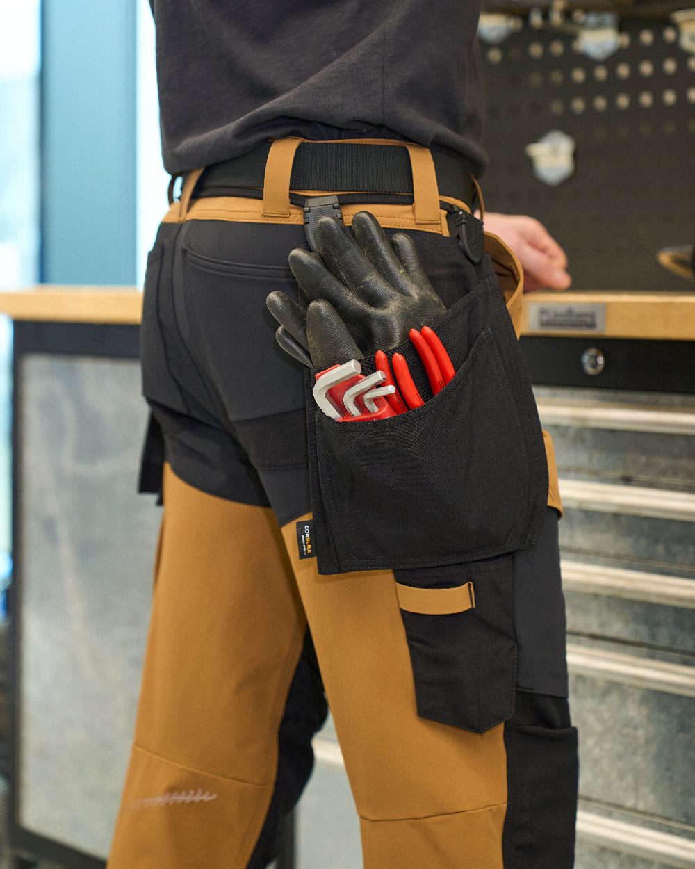 Black Coloured Mascot Workwear Customized Click System Holster Pockets on construction background 