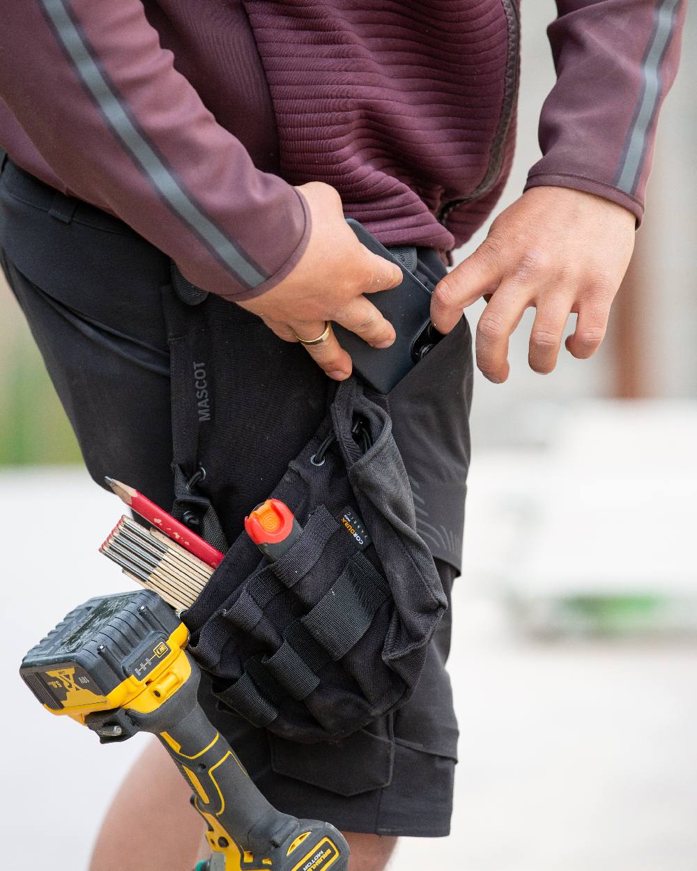 Black Coloured Mascot Workwear Customized Craftsman Holster Pocket on outdoor background 