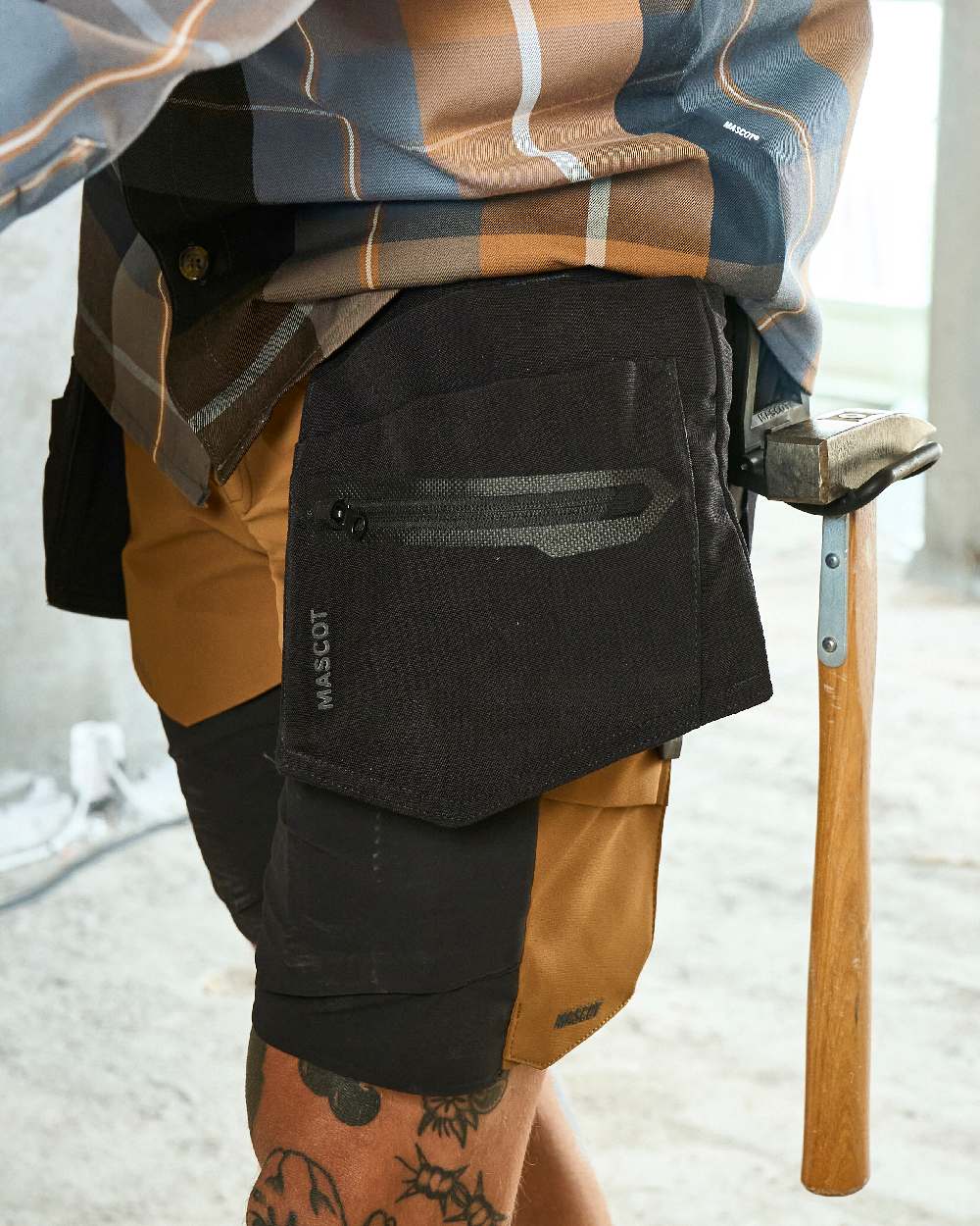 Black Coloured Mascot Workwear Customized Craftsman Holster Pockets on construction background 