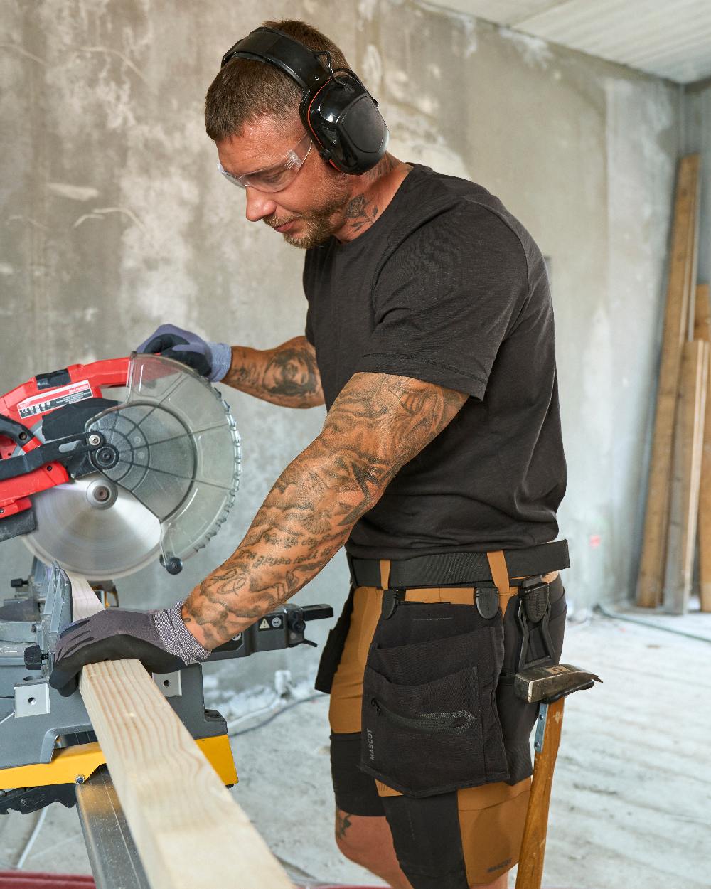 Black Coloured Mascot Workwear Customized Craftsman Holster Pockets on construction background 